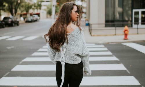 a person walking in a crosswalk