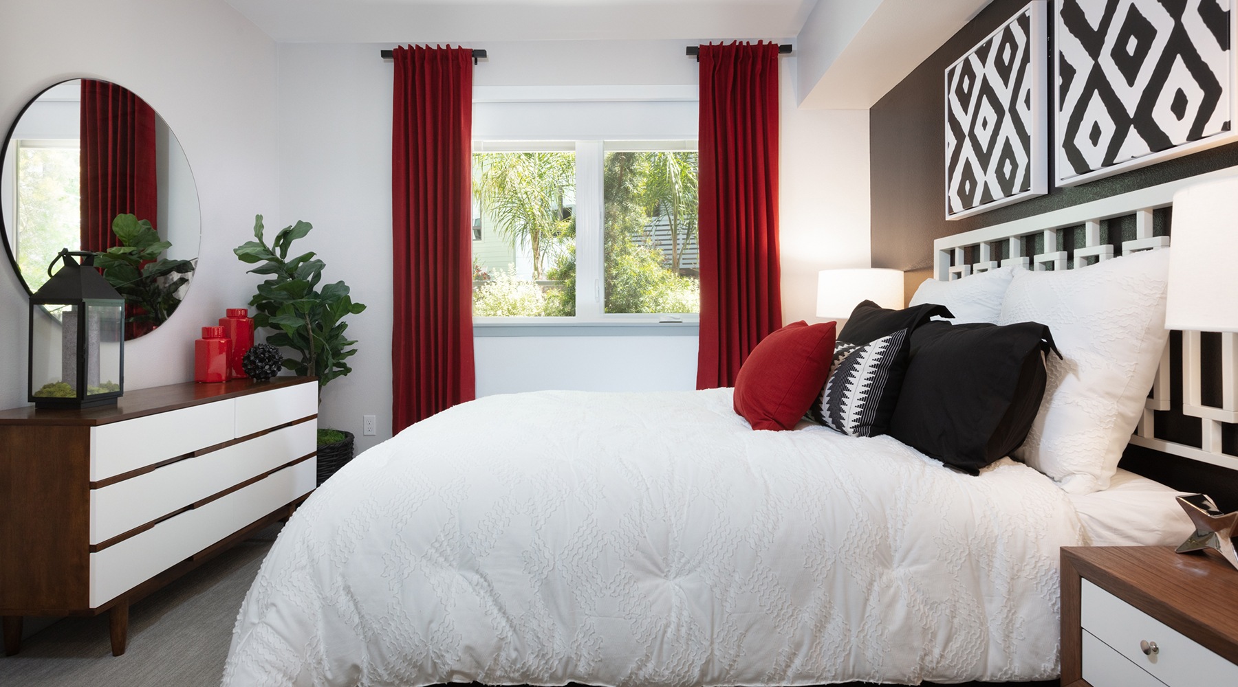 bedroom with bed and red curtains