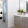 a bathroom with a bed and a sink